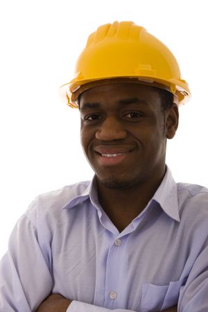african engineer smilling over a white background (selective focus)の写真素材