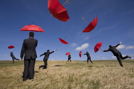 businessman find the best insurance solution out there (some sharp, some extreme movement with motion blur; it's all the same person)の写真素材