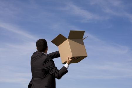 businessman with an open box to the skyの写真素材