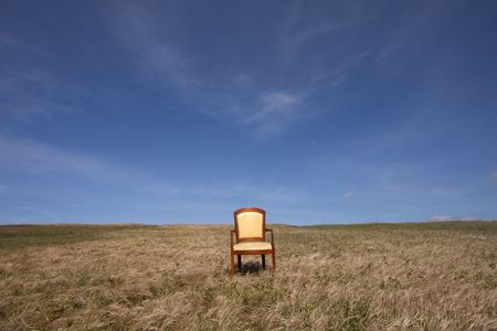 empty chair outside at the grass fieldの写真素材
