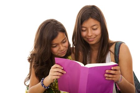 two young student sisters reading books on the floorの写真素材