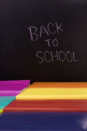 books next to a chalkboard  (selective focus)の写真素材