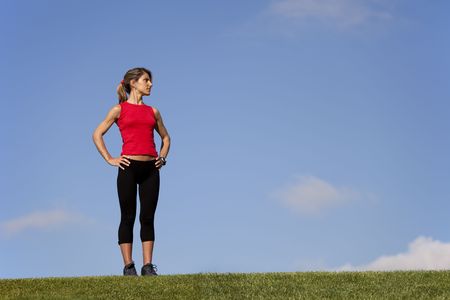 sport woman at the field enjoying natureの写真素材