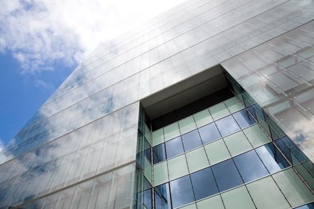detail of a modern office building with sky reflection
