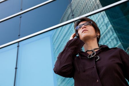 Modern businesswoman talking on the cellularの写真素材
