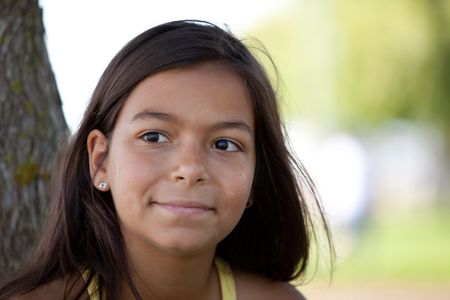young female child at the park with a big smileの写真素材