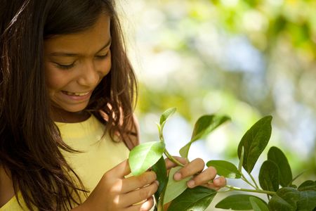 young happy female child enjoying natureの写真素材