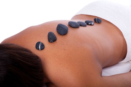 woman in a spa enjoying a hot stone treatmentの写真素材