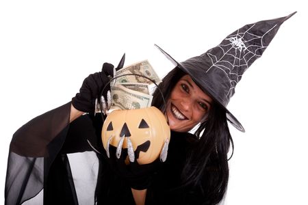 halloween witch saving money on her pumpkinの写真素材
