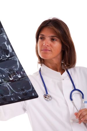 woman doctor looking at an x-ray (isolated on white)の写真素材