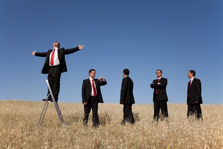 group of businessman in line waiting for there time to be successfulの写真素材