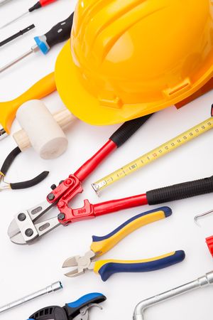 a mix of construction tools over a white backgroundの写真素材