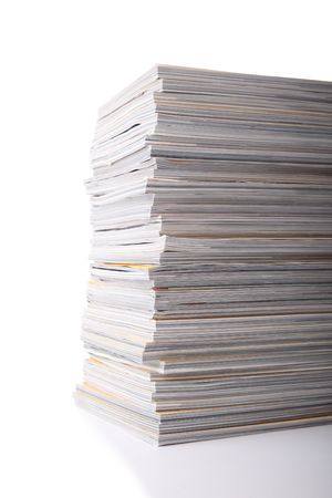Stack of magazines isolated on white with reflection