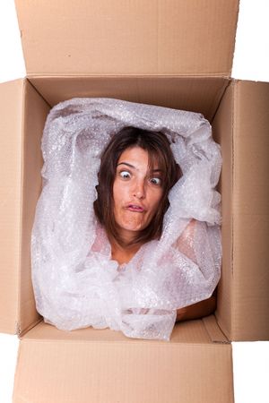 woman face inside a cardboard box smilingの写真素材