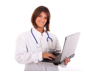 friendly woman doctor working with a laptop (isolated on white)の写真素材