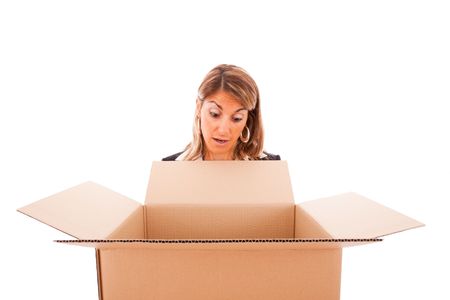 woman reaction looking inside of a open parcel (isolated on white)の写真素材