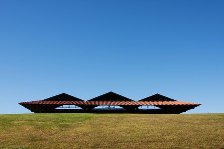 modern construction roof over the green grass