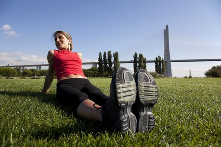 young woman doing some exercise at the park