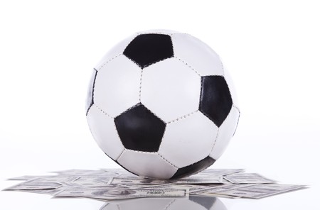 soccer ball over a lot of money (selective focus)の写真素材