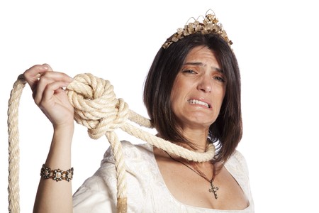 Sad beautiful bride with a hanging rope (isolated on white)の写真素材