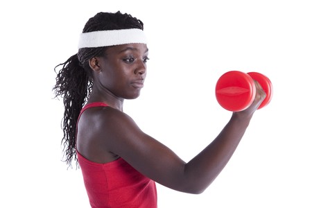 african young woman exercising her muscle with dumbbell (isolated on white)の写真素材