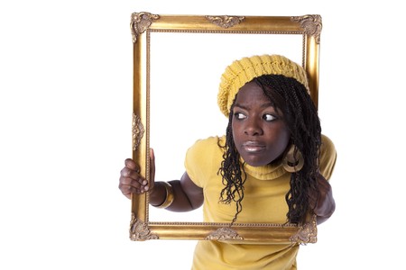 young beautiful african woman inside an antique picture frame (isolated on white)の写真素材