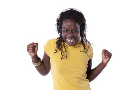 young african woman listening and dancing with headphones (isolated on white)