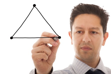 businessman drawing a diagram with the balance between three sides from a triangle (copy space to write on the triangle sides)の写真素材