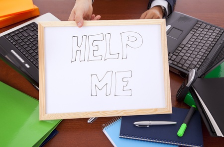 businessman asking for help (hiding his head)