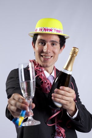 businessman celebrating the new year eve with champagne (isolated on black)の写真素材