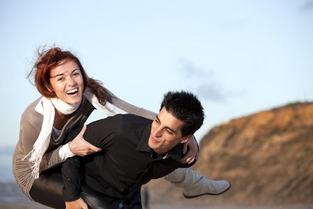 Young couple having a good time together (selective focus with shallow DOF)の写真素材