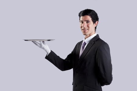 businessman showing you the solution (copyspace over the tray)の写真素材
