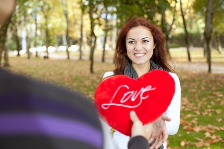 Love and affection between a young couple at valentine day (selective focus with shallow DOF)