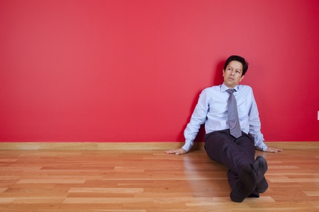 businessman sitting in the floor of his new houseの写真素材