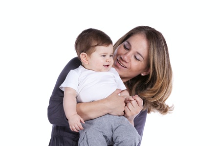 Happy mother playing with her baby son (isolated on white)