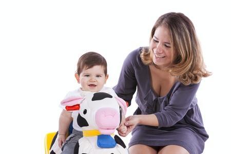 Happy mother playing with her baby son (isolated on white)の写真素材