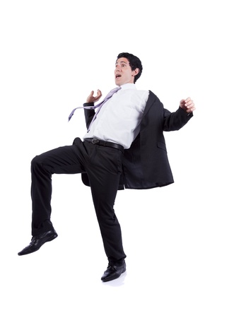 Scared businessman in a falling position (isolated on white)の写真素材