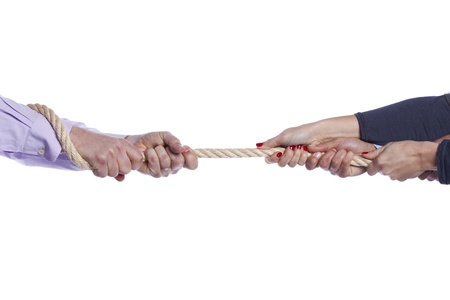 Group of woman hands pulling a rope competing with a man (selective focus)の写真素材