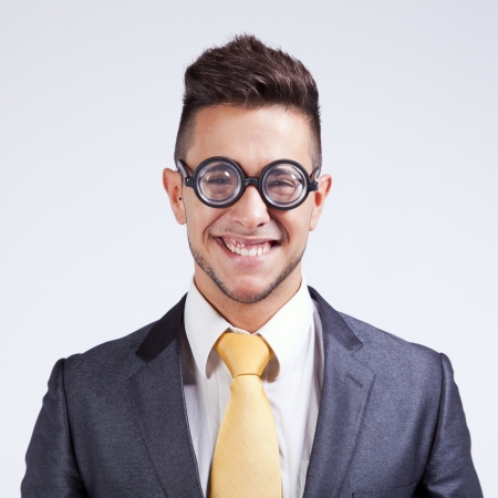 Happy nerd businessman with funny glassesの写真素材
