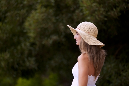 Beauty young woman posing at the forest (selective focus)の写真素材