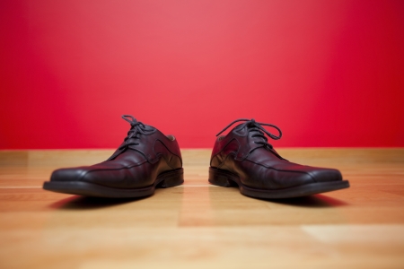 Businessman shoes alone at the floorの写真素材