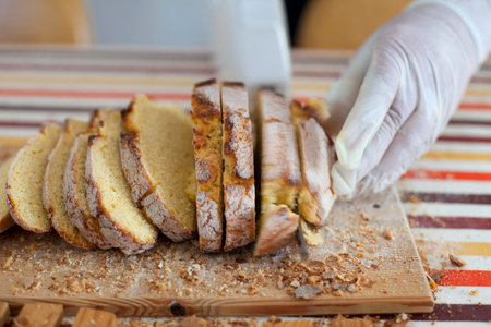 Cutting fresh breadの写真素材