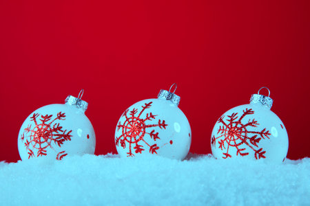 red and white christmas ornament background (selective focus)の写真素材