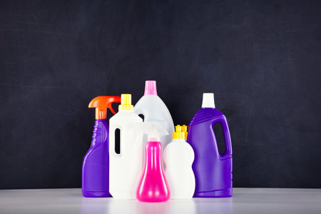 Cleaning products next to a black chalkboard