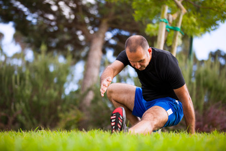 Mature man exercising in a city park