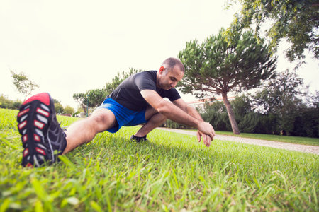Mature man exercising in a city park