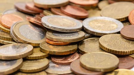 Bulk of various euro coins from different countries in Europe