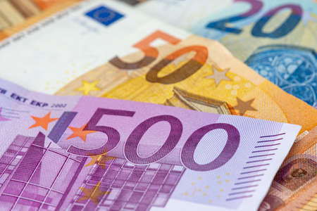 500 euro bank note among 50, 20,10 and 5 euro bank notes. Close-up view