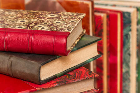 Stack of old books with ancient bindingsの写真素材