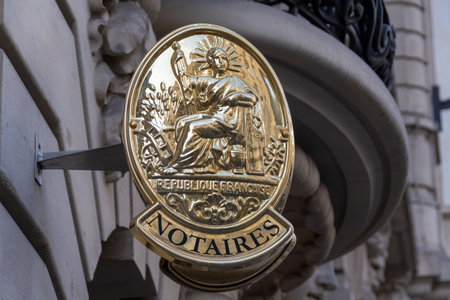 Paris, France - October 23, 2022: Notary sign hanging on the facade of a building in a street in Paris, France. Concepts of notary services and real estate market in Franceのeditorial素材